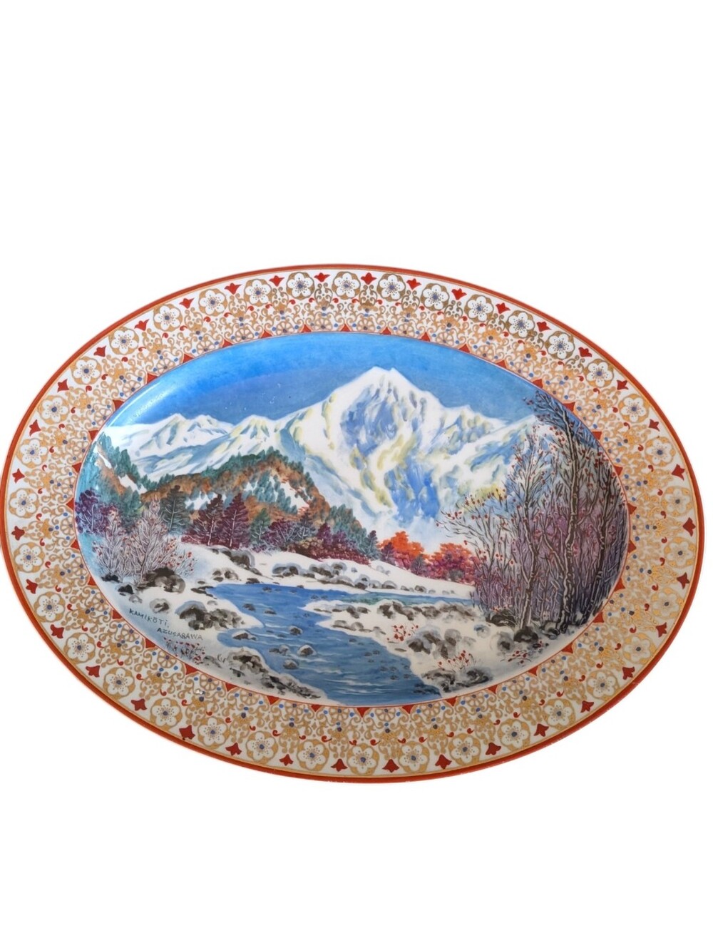 Japanese Kutani porcelain plate featuring a scenic landscape design Hand Painted